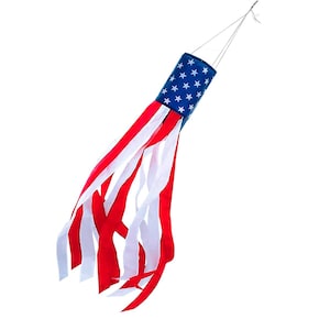 May include: A patriotic windsock featuring the American flag design. The top cylinder is blue with white stars, transitioning to red and white striped streamers. The windsock is designed to hang and catch the wind.
