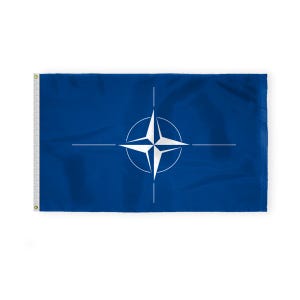 May include: A blue flag featuring the NATO emblem, a white compass rose within a circle, with four lines extending outward. The flag has a white edge with grommets for hanging. The flag is rectangular and made of fabric.