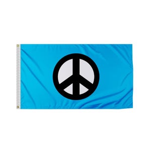 May include: A light blue flag featuring a large black and white peace symbol. The flag is rectangular with a white reinforced edge on the left side and grommets for hanging. The peace symbol is centered on the flag.