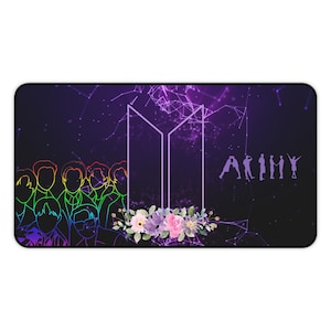 May include: Rectangular mousepad with a purple and black background featuring a line drawing of a group of people in rainbow colors. The design includes a floral arrangement, the letters "BTS", and the word "ARMY".