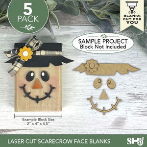 Puede incluir: Una cara de espantap&aacute;jaros de madera con sombrero negro, lazo y flor amarilla. La cara tiene ojos negros, nariz de zanahoria y boca sonriente. El tama&ntilde;o del bloque es de 5.1 cm x 10.2 cm x 11.4 cm. El texto dice "Laser Cut Scarecrow Face Blanks".