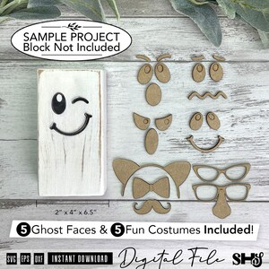 May include: A white rectangular wooden block with a black winking ghost face, accompanied by five sets of laser-cut wooden facial features and costume accessories including eyes, mouths, glasses, a mustache, and a bow tie for crafting projects.