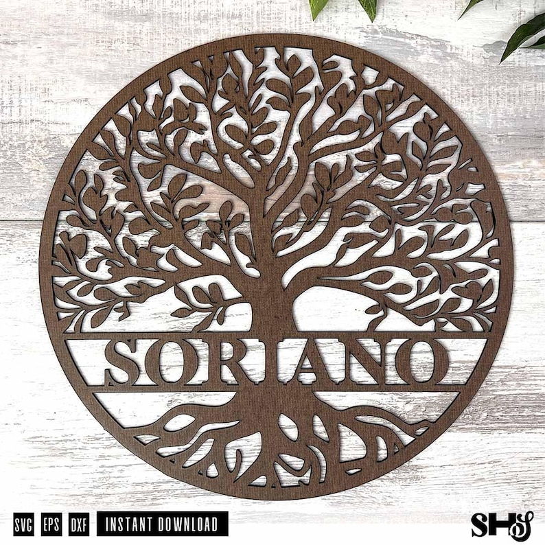 May include: A circular brown wooden wall hanging featuring a laser-cut tree of life design with intricate branches and roots. The name SORIANO is prominently displayed in capital letters across the center of the tree trunk within the circle.