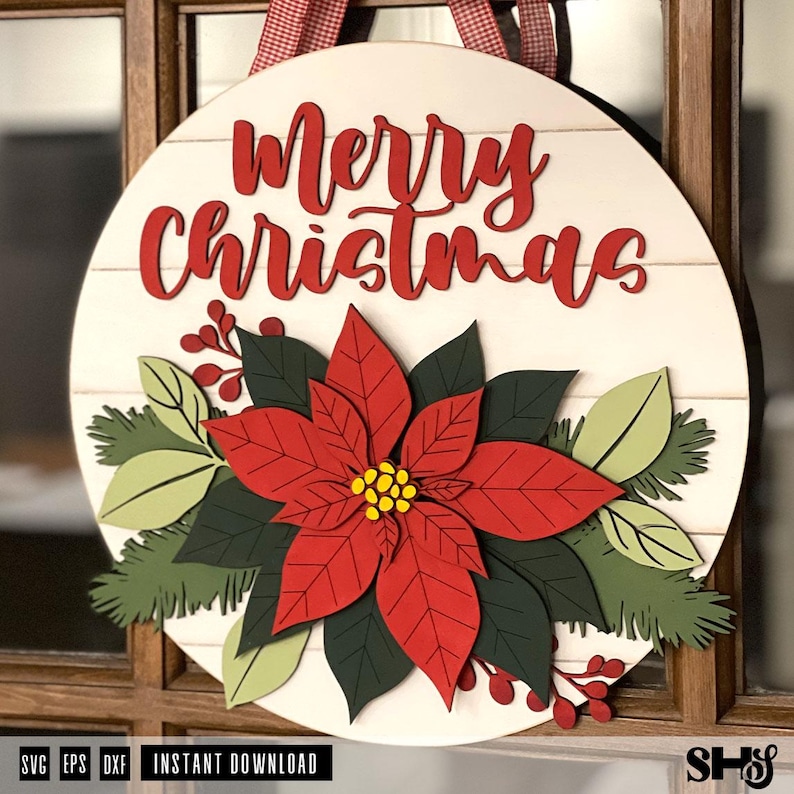 K&ouml;nnte beinhalten: Ein rundes T&uuml;rschild aus Holz mit dem roten Schriftzug Merry Christmas oben. In der Mitte befindet sich ein mehrschichtiger Weihnachtsstern mit roten Bl&uuml;tenbl&auml;ttern und gelber Mitte, umgeben von dunkelgr&uuml;nen Bl&auml;ttern und roten Beeren.