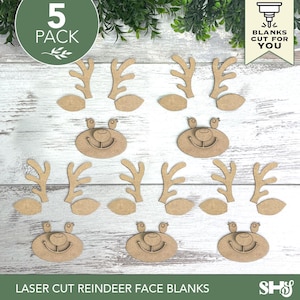 May include: A 5-pack of laser-cut wooden reindeer face blanks, including five oval-shaped faces with etched eyes, noses, and smiles, along with ten individual antler pieces and ten ear pieces, all featuring a natural light brown wood finish.