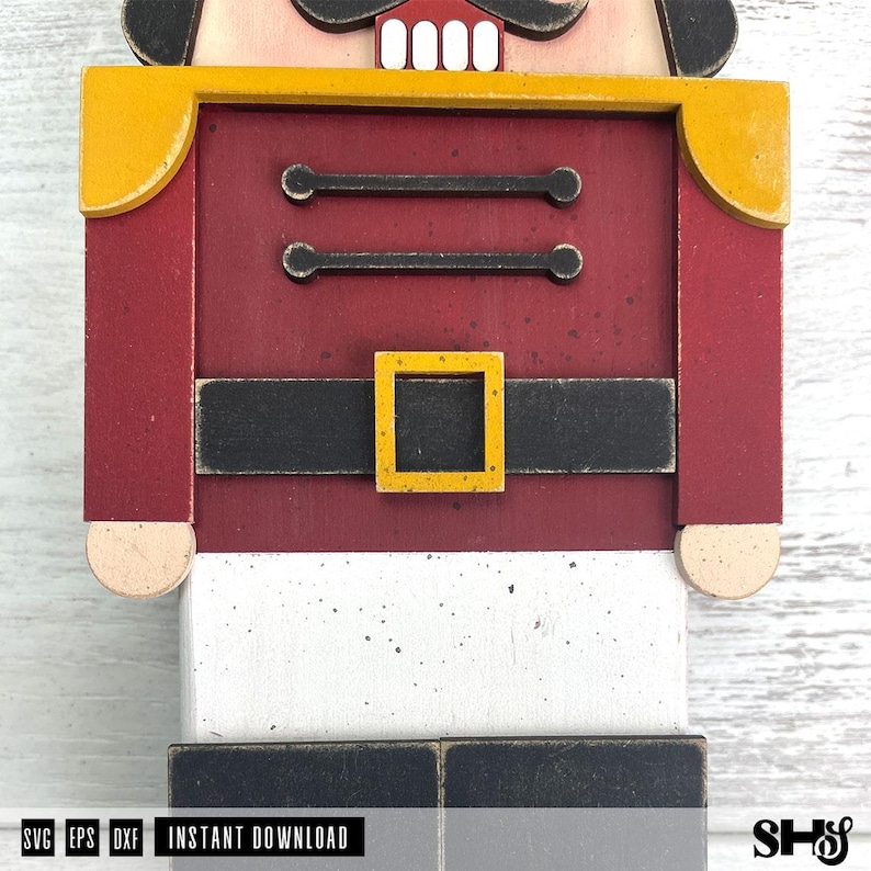 May include: A wooden nutcracker cutout featuring a red jacket with yellow shoulder accents, a black belt with a yellow square buckle, and white trousers. The design includes two horizontal black bars on the chest and black boots. Text reads SVG EPS DXF INSTANT DOWNLOAD.