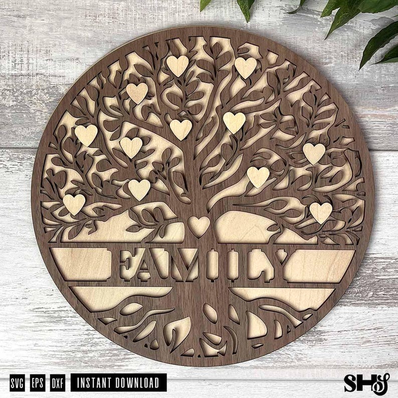 May include: A circular wooden wall art piece featuring a laser-cut tree design with intricate branches and roots. The word FAMILY is cut out in the center, surrounded by several small heart-shaped cutouts integrated into the tree canopy.