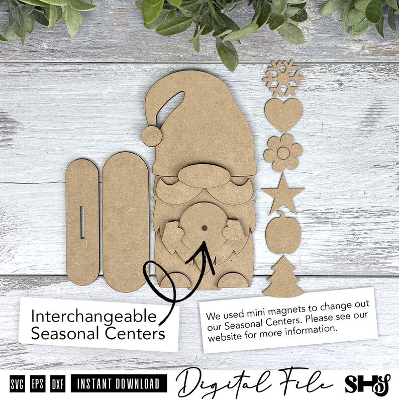 May include: A light brown wooden gnome cutout with a hat, beard, and moustache, accompanied by two rectangular base pieces and six small interchangeable shapes including a snowflake, heart, flower, star, pumpkin, and tree for seasonal decor.