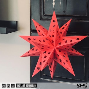 May include: A bright red, multi-pointed star lantern made of folded paper. The surface of the star features numerous small, die-cut star-shaped perforations throughout its structure, allowing light to pass through the geometric design.
