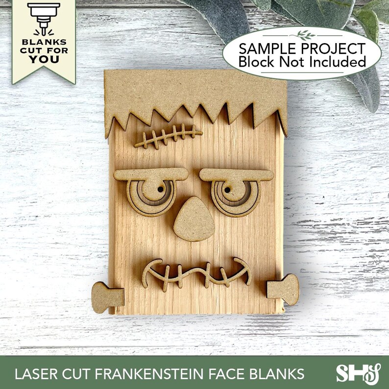 May include: A set of laser-cut wooden Frankenstein face pieces including a jagged hair section, two eyes with brows, a triangular nose, a stitched mouth, and two side bolts. The pieces are light brown and unfinished, designed for assembly.