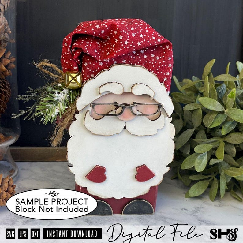 May include: A decorative Santa Claus figure made of layered wood with a red fabric hat featuring a white star pattern. The figure has a white beard, mustache, and eyebrows, wears black-rimmed glasses, and has red mittens. A gold bell and greenery are attached to the side of the hat.