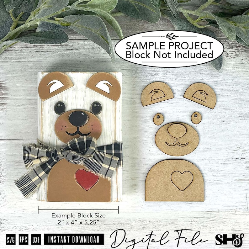 May include: A digital file for a bear craft project featuring a white wooden block with a bear face, ears, and a red heart, accented by a black and white plaid ribbon. Includes separate cutouts for ears, nose, and heart, with text stating 2" x 4" x 5.25".