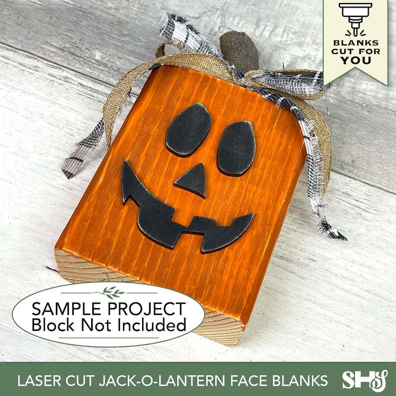 May include: Wooden jack-o-lantern face with a carved-out smile and eyes. The pumpkin is orange with black facial features and a burlap and plaid ribbon. The text "SAMPLE PROJECT Block Not Included" is visible.
