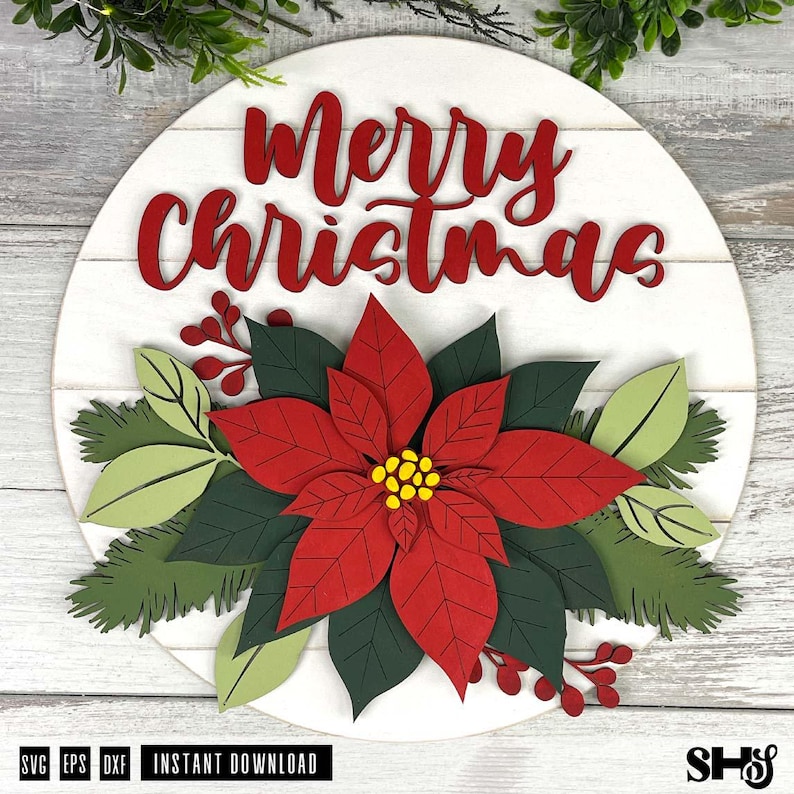 K&ouml;nnte beinhalten: Ein rundes wei&szlig;es Holzschild mit horizontalen Plankenlinien und dem roten Schriftzug Merry Christmas. Das Schild ist mit geschichteten Ausschnitten einer gro&szlig;en roten Weihnachtssternbl&uuml;te, dunkelgr&uuml;nen Bl&auml;ttern, hellgr&uuml;nen Bl&auml;ttern und roten Beeren verziert.