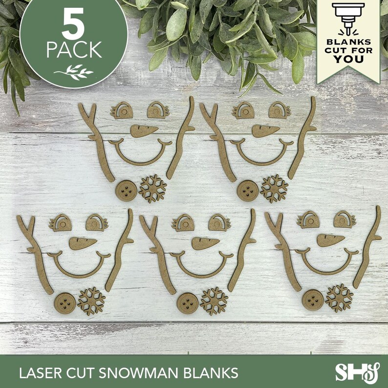 May include: A 5-pack of laser-cut wooden snowman face components, including eyes, carrot noses, curved mouths, stick arms, buttons, and snowflake shapes. These unfinished wood pieces are designed for crafting and holiday decoration projects.