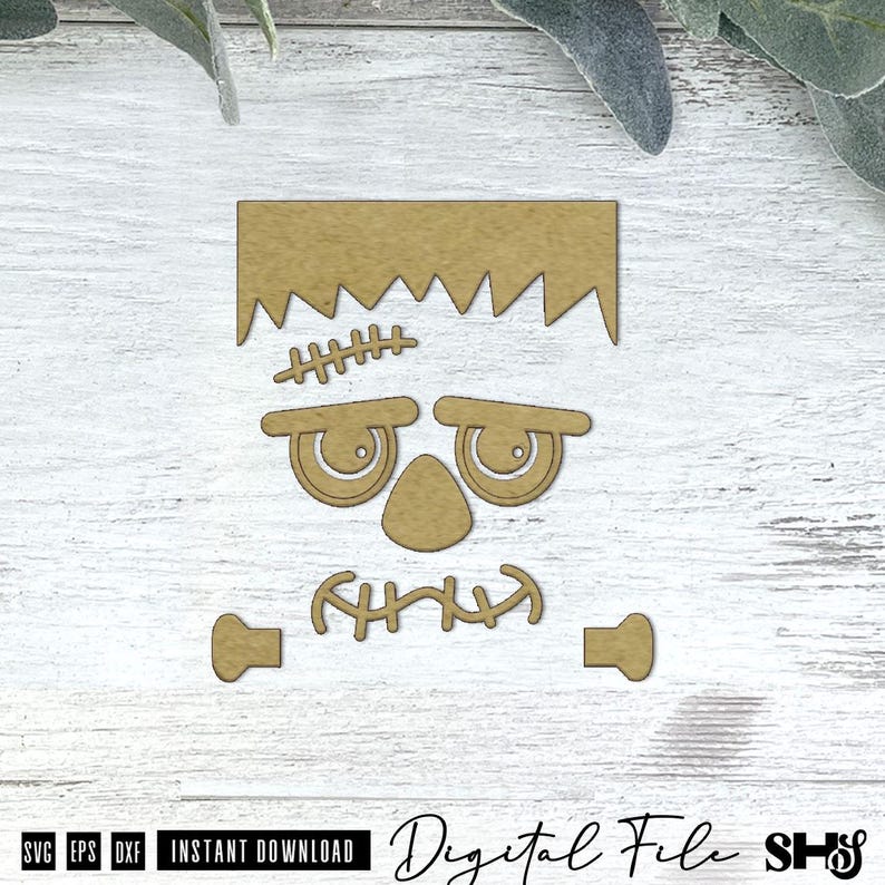 May include: A tan-colored, flat, laser-cut wooden shape depicting a monster face with a jagged hairline, a stitched forehead scar, heavy eyelids, a triangular nose, a stitched mouth, and two separate bolt-like shapes for the sides of the head.