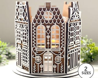 May include: A brown and white laser-cut wooden house-shaped candle holder featuring intricate architectural details, arched windows, and heart-shaped cutouts. The structure is composed of multiple panels with a scalloped roof design and a circular base.