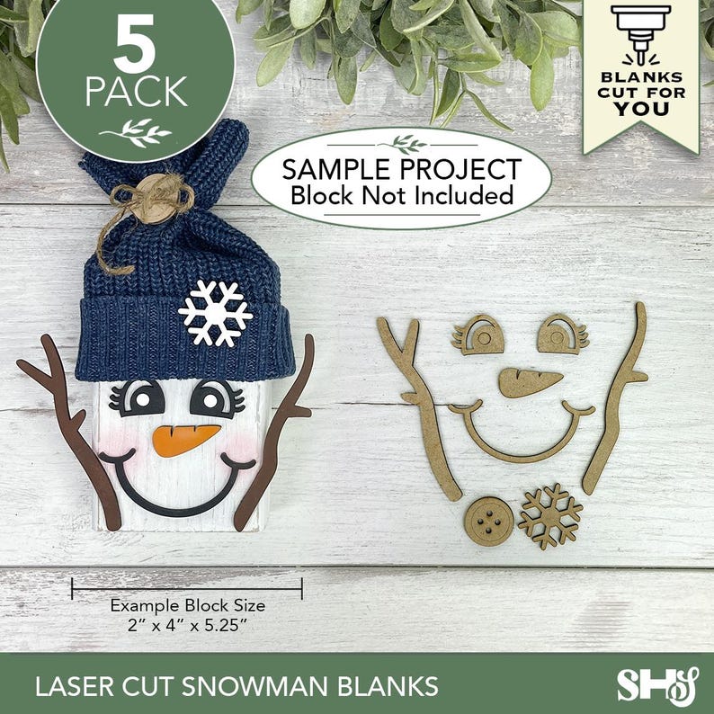 May include: A set of laser cut snowman blanks including two eyes, a carrot nose, a mouth, two stick arms, a button, and a snowflake. A sample project shows a white block with a navy blue knit hat and these pieces attached. Text reads 5 PACK, BLANKS CUT FOR YOU, SAMPLE PROJECT Block Not Included, and Example Block Size 2" x 4" x 5.25".