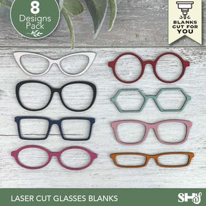 May include: A collection of eight laser-cut glasses blanks in various shapes and colors, including white, black, red, blue, pink, and orange. The image includes text that reads "8 Designs Pack" and "Blanks Cut For You."