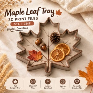 Puede incluir: Una bandeja con forma de hoja de arce con bordes elevados y nervaduras en relieve. La bandeja contiene dos bellotas, una piña, dos rodajas de naranja seca y pequeñas hojas rojas. El texto dice: Maple Leaf Tray, 3D PRINT FILES, STL | 3MF.