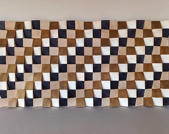 May include: A rectangular wall art piece composed of numerous small, square wooden blocks arranged in a grid. The blocks feature varying depths and are finished in alternating colors of natural light wood, dark brown, and metallic gold.