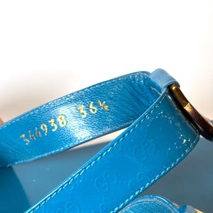Close-up of the interior strap showing embossed gold serial numbers 344938 and size 36.5.