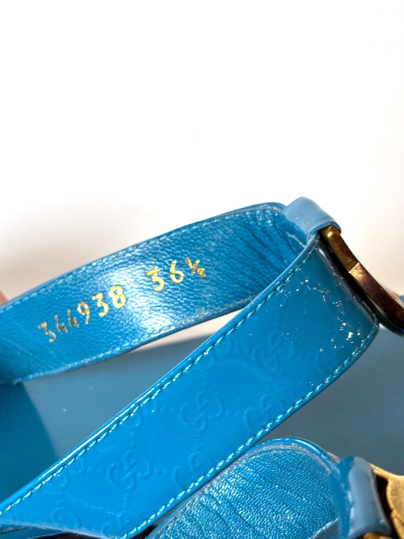 Close-up of the interior strap showing embossed gold serial numbers 344938 and size 36.5.