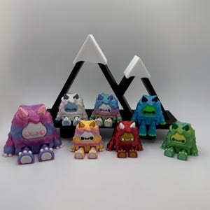 3d printed articulated yetis with mountain display option– cute poseable creatures – layers in green design
