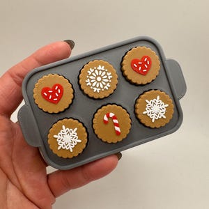 3d printed cookie sheet clickers • holiday baking fidget toy • gingerbread cookie tray