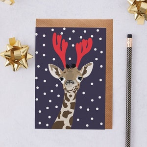 Giraffe Christmas card, Giraffe wearing antlers in the snow