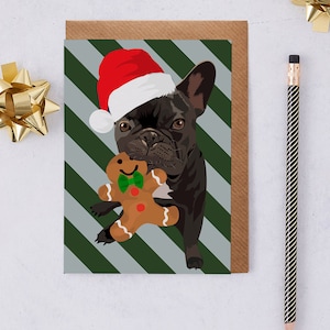 Weihnachtskarte mit französische Bulldogge die eine Nikolausmütze mit einem Lebkuchenmann trägt