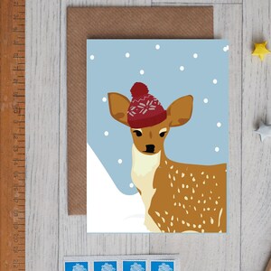 Christmas deer card, wearing a wooly hat.