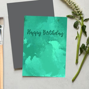 Happy Birthday greeting card with green painted background