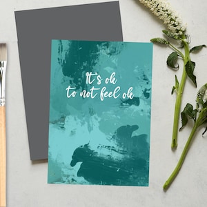 Está tudo bem, não se sinta bem com o pincel do cartão pintado no fundo. mensagens positivas
