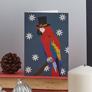Carte de Noël perroquet, portant un chapeau haut de forme avec des baies