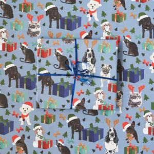 Pets with Christmas presents, gift wrap, king Charles spaniel, cockapoo, bichon frise, siamese cat, french bulldog, spaniel and pug