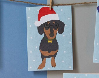 Christmas sausage dog, dachshund in santa hat, mini dachshund