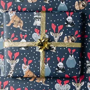 Go wild Christmas wrapping paper, elephant, giraffe, penguin, sloth and tiger