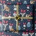 Go wild Christmas wrapping paper, elephant, giraffe, penguin, sloth and tiger 