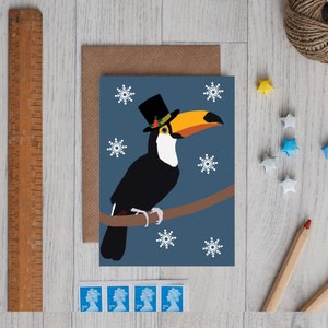 Toucan Christmas card wearing Christmas hat
