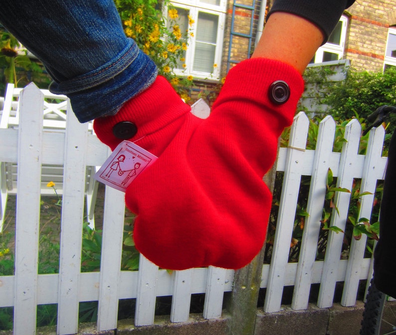 Red Smitten mitten, a shareable couples mitten. Winter accessory for couples to hold hands with.