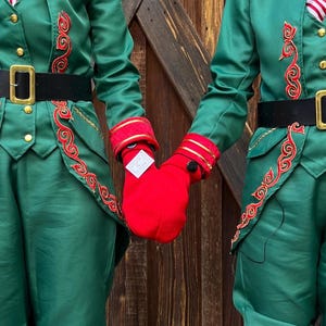 Red Smitten mitten, a shareable couples mitten. Winter accessory for couples to hold hands with.