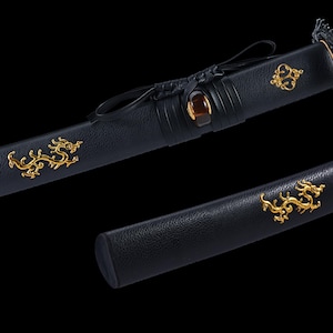 May include: Close-up of a black sword scabbard with gold dragon and decorative accents. The scabbard features a leather texture and a dark brown gem. The sword is a traditional Japanese weapon.