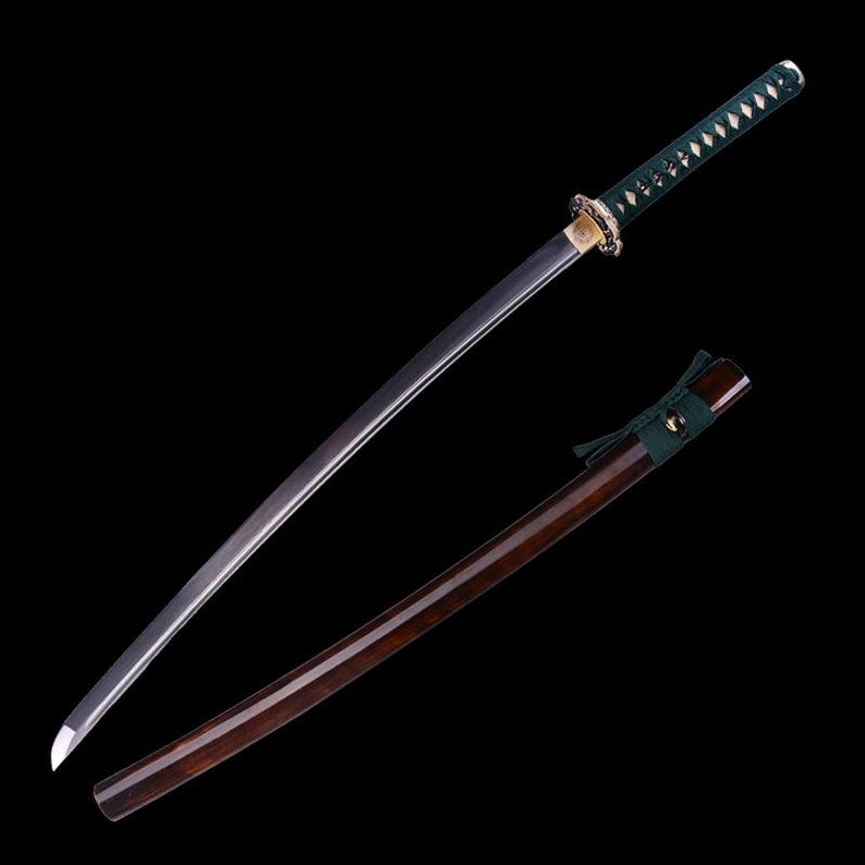 May include: A traditional Japanese katana sword with a dark wooden scabbard and a green and black handle. The blade is sharp and polished.