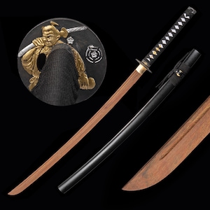 May include: A traditional Japanese katana sword with a wooden scabbard and a black leather handle. The sword has a gold-colored hilt with a decorative design. The sword is displayed on a black background.