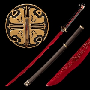 May include: A decorative katana with a red blade and black handle. The handle is wrapped in a black and red diamond pattern. The scabbard is dark brown with gold accents. A gold and black circular display stand is in the background.