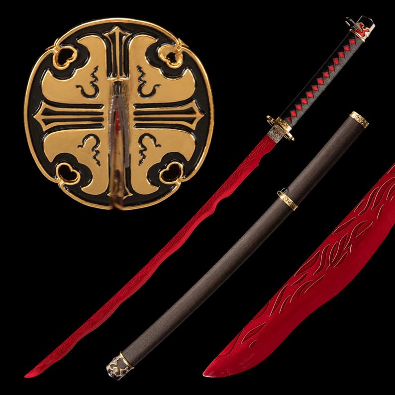 May include: A decorative katana with a red blade and black handle. The handle is wrapped in a black and red diamond pattern. The scabbard is dark brown with gold accents. A gold and black circular display stand is in the background.