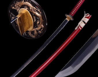 May include: A traditional Japanese katana sword with a black blade and a red scabbard. The sword is displayed on a stand with a dragon design.