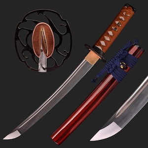 May include: A traditional Japanese katana sword with a curved blade, a brown and gold handle, and a red and black scabbard. The sword is displayed on a black background.