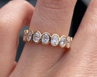Oval Moissanite Eternity Band: 14K Yellow Gold Bezel Wedding Ring